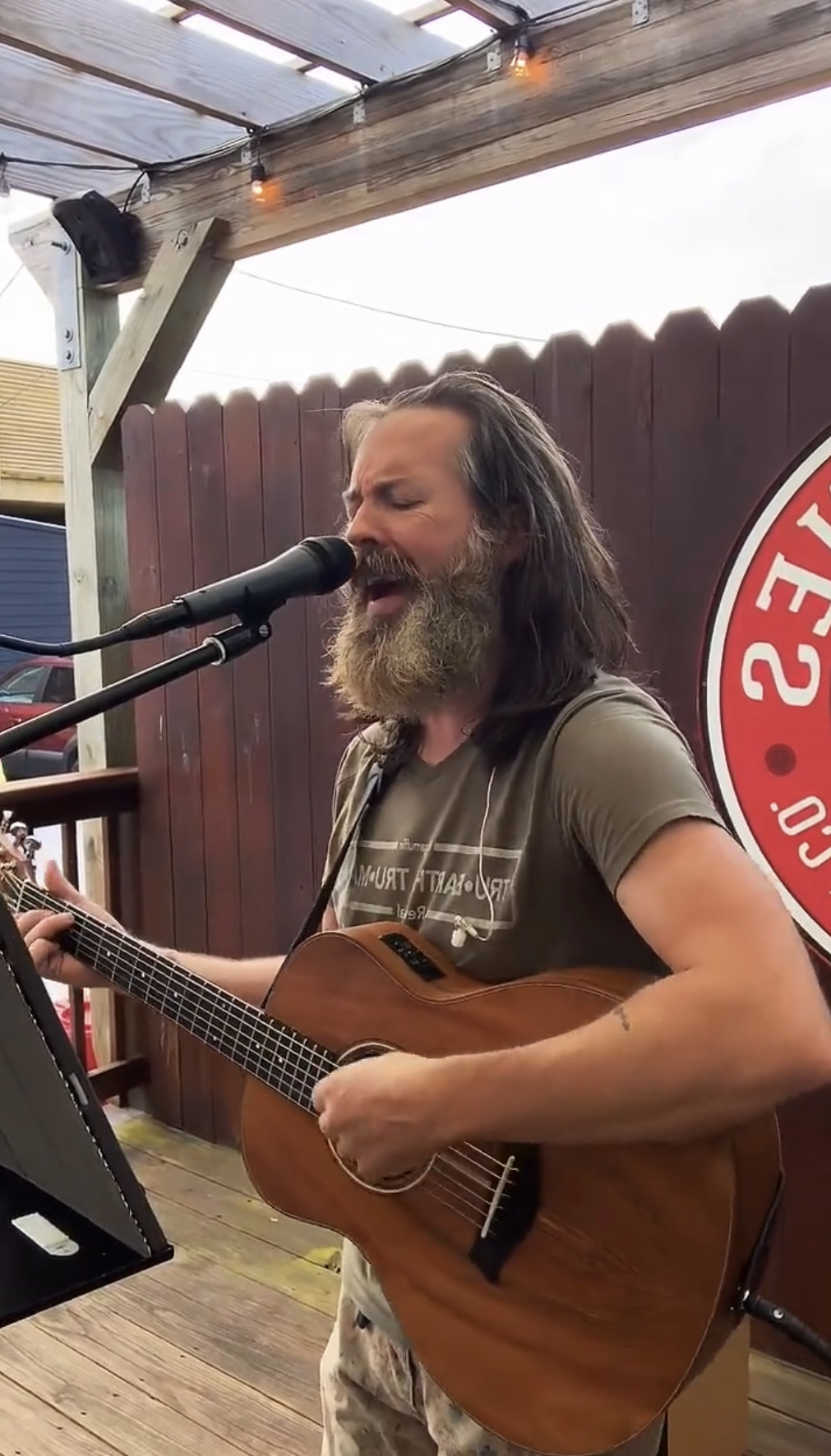 Robbie Carrier singing outdoors